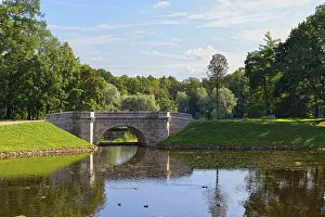 Summer landscape with lake and bridge in Gatchina park