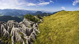 At the summit of Alpbichl with a view of the Lammertal and Tennengebirge mountains