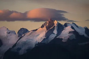 Summit of the Bernina Group with dramatic cloudy sky