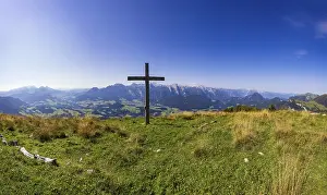 Summit cross on the Einberg with a view of the Lammertal and Tennengebirge mountains