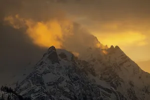 Summit Kleiner and Grosser Bettelwurf with clouds at sunset in winter
