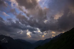 Summit in the morning light with dramatic clouds