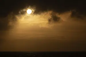 Sun bursts out from behind clouds