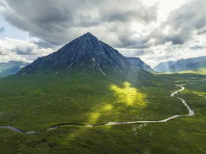 Category Mountain Landscapes Prints: Sun Rays over The Buachaille or Buachaille Etive Mor and River Coupall from a drone