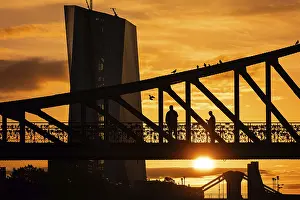 The sun rises behind the European Central Bank (ECB)