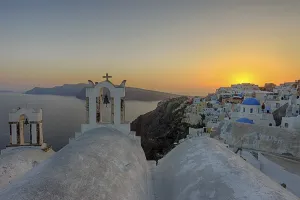 The sun sets in Oia on Santorini