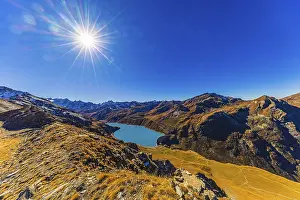 The sun shines over the mountains of the Val d'Anniviers