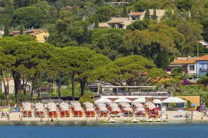 Sunbeds and parasols on the beach of Fetovaia