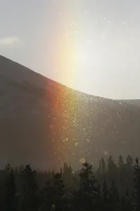Sundog appearing in ice fog, rainbow colours