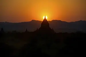 Sundown over the tip of a stupa Bagan Burma