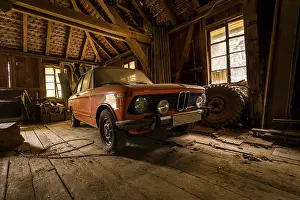 Framed Print : Sunlit Barn-Find: Dusty Orange Classic Car in Abandoned Wooden Workshop