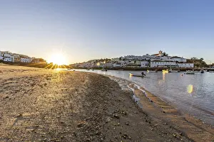 Category Historic EN Prints: Sunrise on the Atlantic, skyline of a fishing village behind a harbour