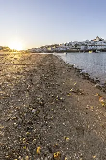 Category Historic EN Prints: Sunrise on the Atlantic, skyline of a fishing village behind a harbour