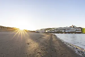 Category Historic EN Prints: Sunrise on the Atlantic, skyline of a fishing village behind a harbour