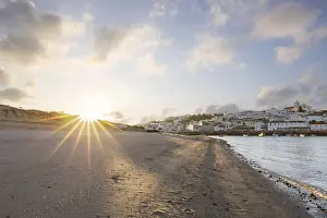 Category Historic EN Prints: Sunrise on the Atlantic, skyline of a fishing village behind a harbour