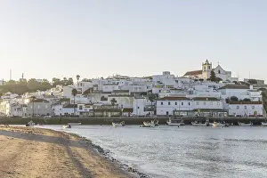 Category Historic EN Prints: Sunrise on the Atlantic, skyline of a fishing village behind a harbour