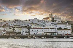 Category Historic EN Prints: Sunrise on the Atlantic, skyline of a fishing village behind a harbour