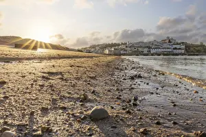 Category Historic EN Prints: Sunrise on the Atlantic, skyline of a fishing village behind a harbour