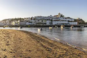 Category Historic EN Prints: Sunrise on the Atlantic, skyline of a fishing village behind a harbour