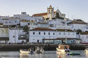 Category Historic EN Prints: Sunrise on the Atlantic, skyline of a fishing village behind a harbour