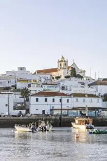 Category Historic EN Prints: Sunrise on the Atlantic, skyline of a fishing village behind a harbour