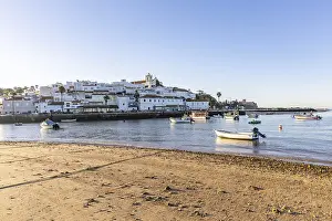 Category Historic EN Prints: Sunrise on the Atlantic, skyline of a fishing village behind a harbour
