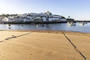 Category Historic EN Prints: Sunrise on the Atlantic, skyline of a fishing village behind a harbour