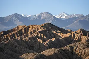 Sunrise over canyons, Tian Shan mountains in the background