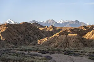 Sunrise over canyons, Tian Shan mountains in the background