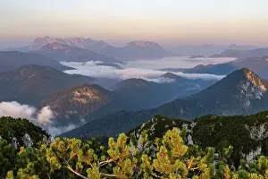 Sunrise in the Chiemgau Alps with a view of the Wilder Kaiser and fog in the valley