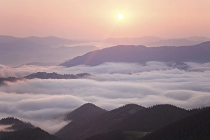 Category Mountain Landscapes Prints: Sunrise over cloudy mountain ridge