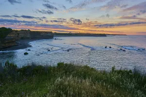 Sunrise on the coast with colourful sky and calm sea