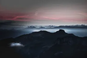 Sunrise and fog over mountains towards Lake Constance from summit Schaefler