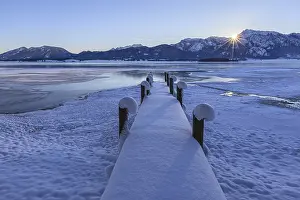 Sunrise at a lake in front of mountains