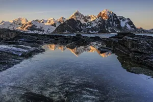 Sunrise, morning light, steep mountains by the sea