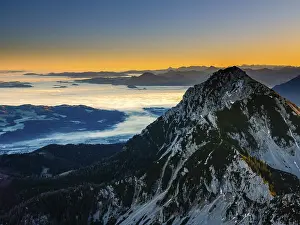 Sunrise in the mountains, view of Salzburg with fog