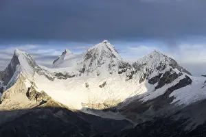 sunrise over the four peaks of Nevado Huandoy in the Andes of Peru in the central Cordillera Blanca