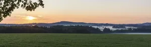 Sunrise at the Pfarrlinde, view of fog near Rammenau