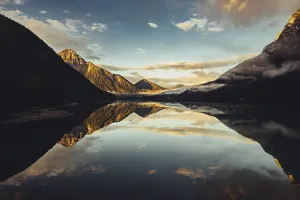 Sunrise with reflections in Lake Heiterwanger See in Tyrol in the Alps in Austria