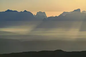 Sunrise over South Tyrolean mountains with haze in the valley