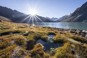 Sunrise at the turquoise Ala Kul mountain lake