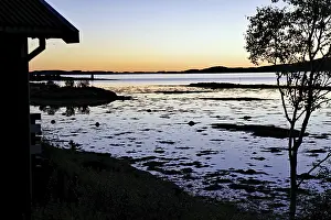 Sunset at a campsite, quiet fjord