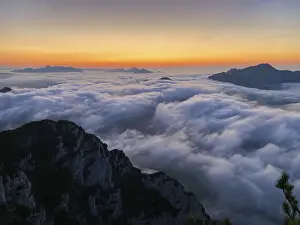 Sunset in the Chiemgau Alps with fog in the valley