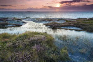 Sunset, evening atmosphere at the coastline near Smoegen