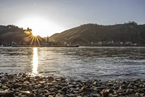 Sunset over the hills by the river
