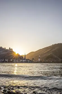 Sunset over the hills by the river