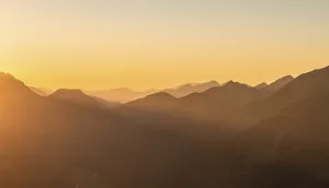 Sunset behind mountain silhouette