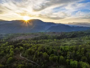 Sunset over Mountains and Coniston Water from drone
