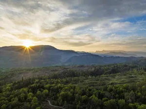 Sunset over Mountains and Coniston Water from drone