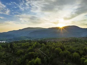 Sunset over Mountains and Coniston Water from drone